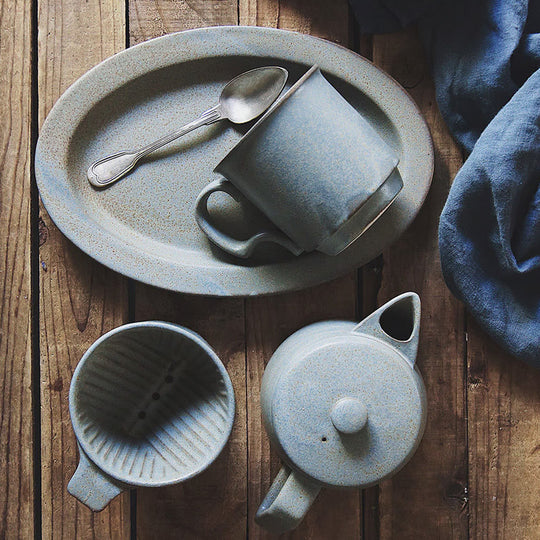 A pot with simple details that gives it a sophisticated look. It has a generous capacity of 500ml and comes with a stainless steel tea strainer. It not only looks good but is also easy to use and comfortable to hold. Pair with Ancient Pottery Mug for a great looking set. This pot is also highly practical as it is made of durable stoneware. <span data-mce-fragment="1">A bluish grey with a nice texture like the blue rust of copper.</span>