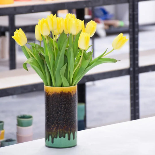 Extra Large Porcelain cylinder vase from London based SGW Lab, glazed in shades of pistachio green, indigo on an earthy natural base.