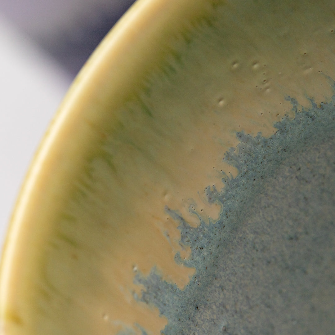 Extra Large Porcelain cylinder vase from London based SGW Lab, glazed in shades of pistachio green, indigo on an earthy natural base.