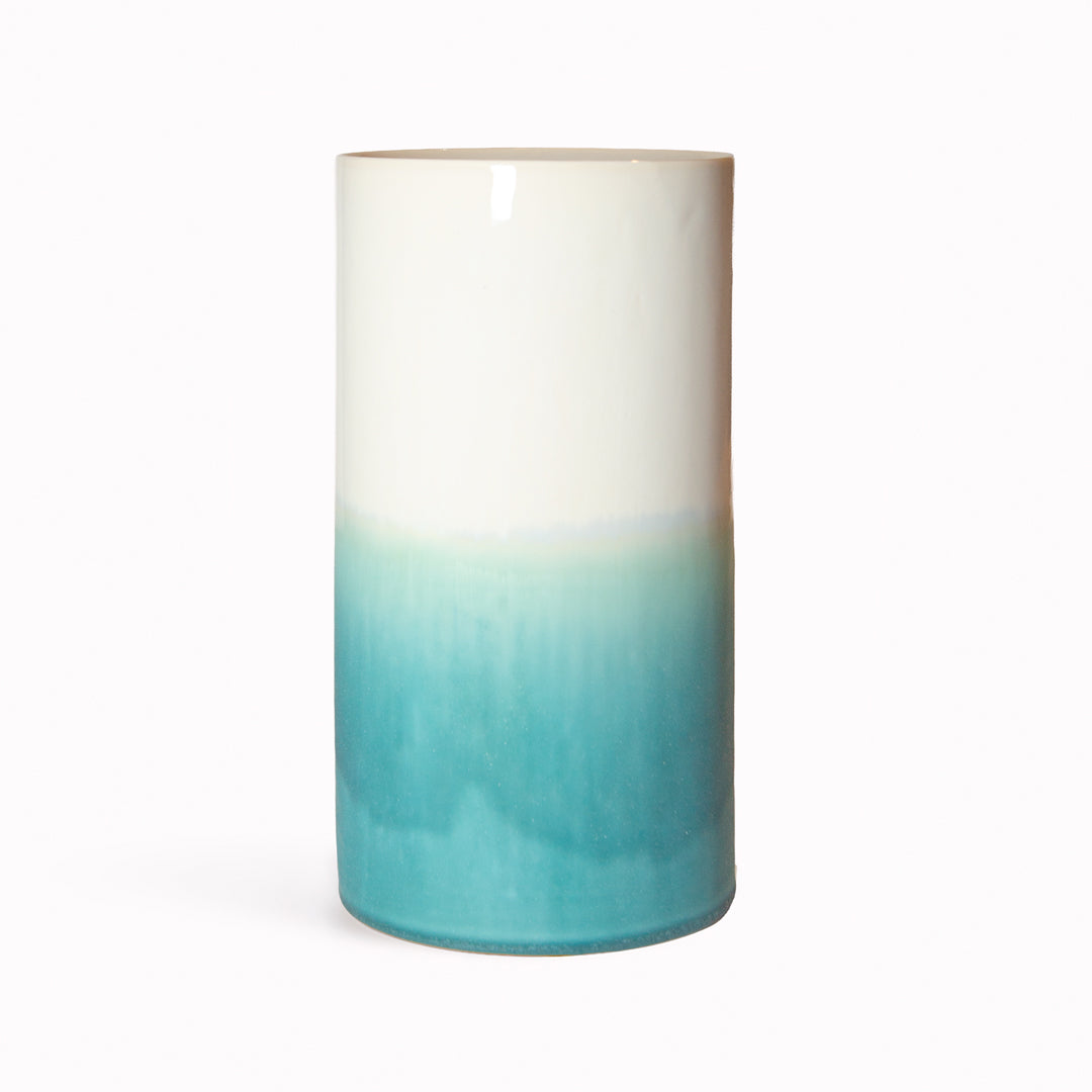 Porcelain cylinder vase from London based SGW Lab, glazed in shades of turquoise on a white base. SGW Lab hand produce bright and bold ceramics in an ever evolving combination of colourful matt and gloss glazes.