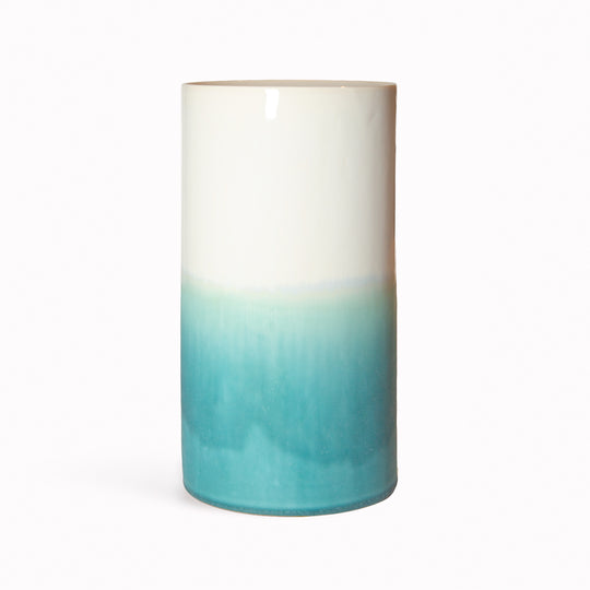 Porcelain cylinder vase from London based SGW Lab, glazed in shades of turquoise on a white base. SGW Lab hand produce bright and bold ceramics in an ever evolving combination of colourful matt and gloss glazes.