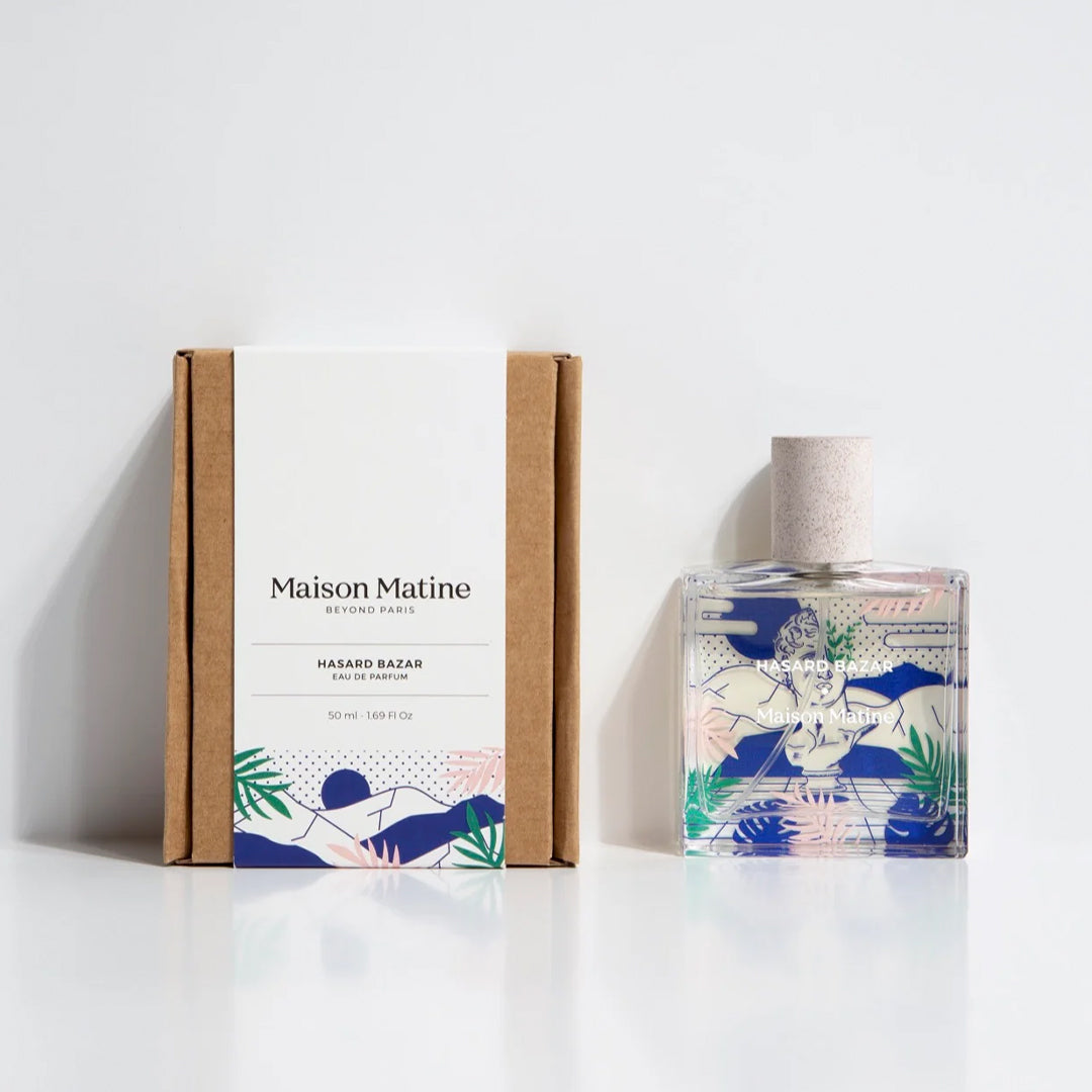 Maison Matine's 'Hasard Bazar' is a scent inspired by multi focus, multi disciplined passion and creativity, all housed in an illustrative glass bottle. 50ml Bottle shown, illustrated with face and leaves. With box.