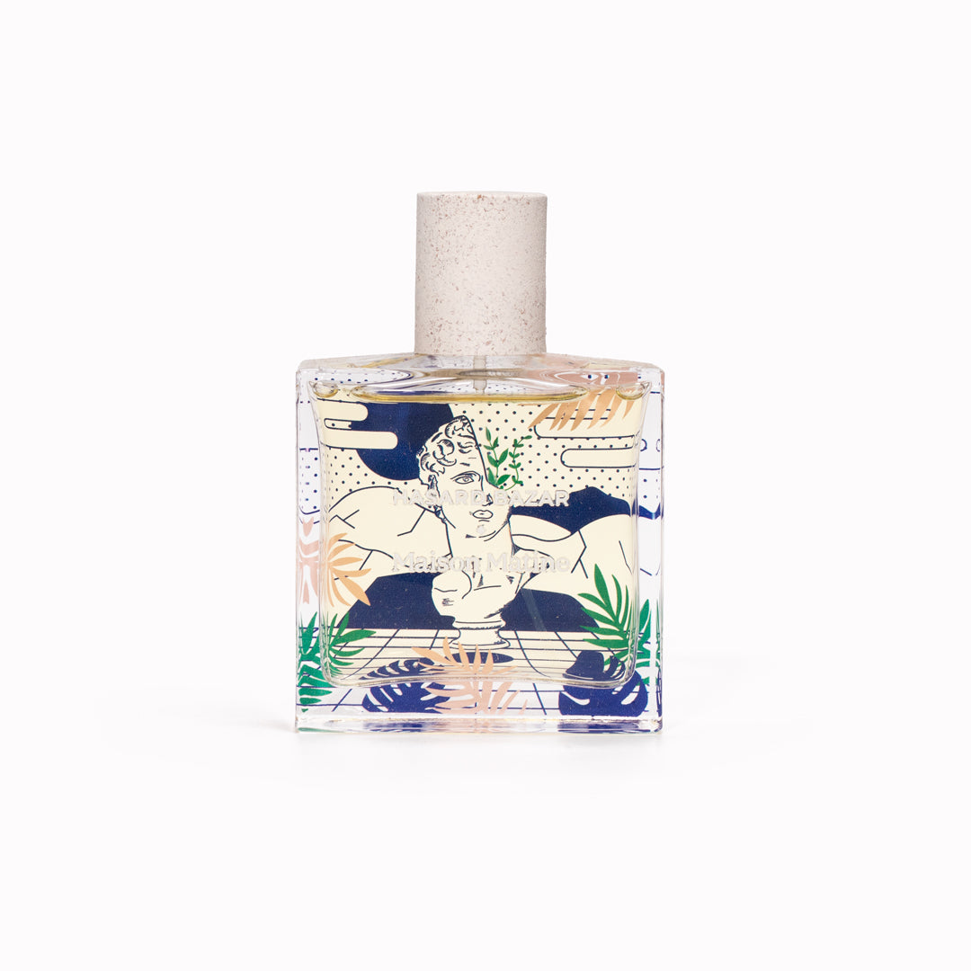 Maison Matine's 'Hasard Bazar' is a scent inspired by multi focus, multi disciplined passion and creativity, all housed in an illustrative glass bottle. 50ml Bottle shown, illustrated with face and leaves.