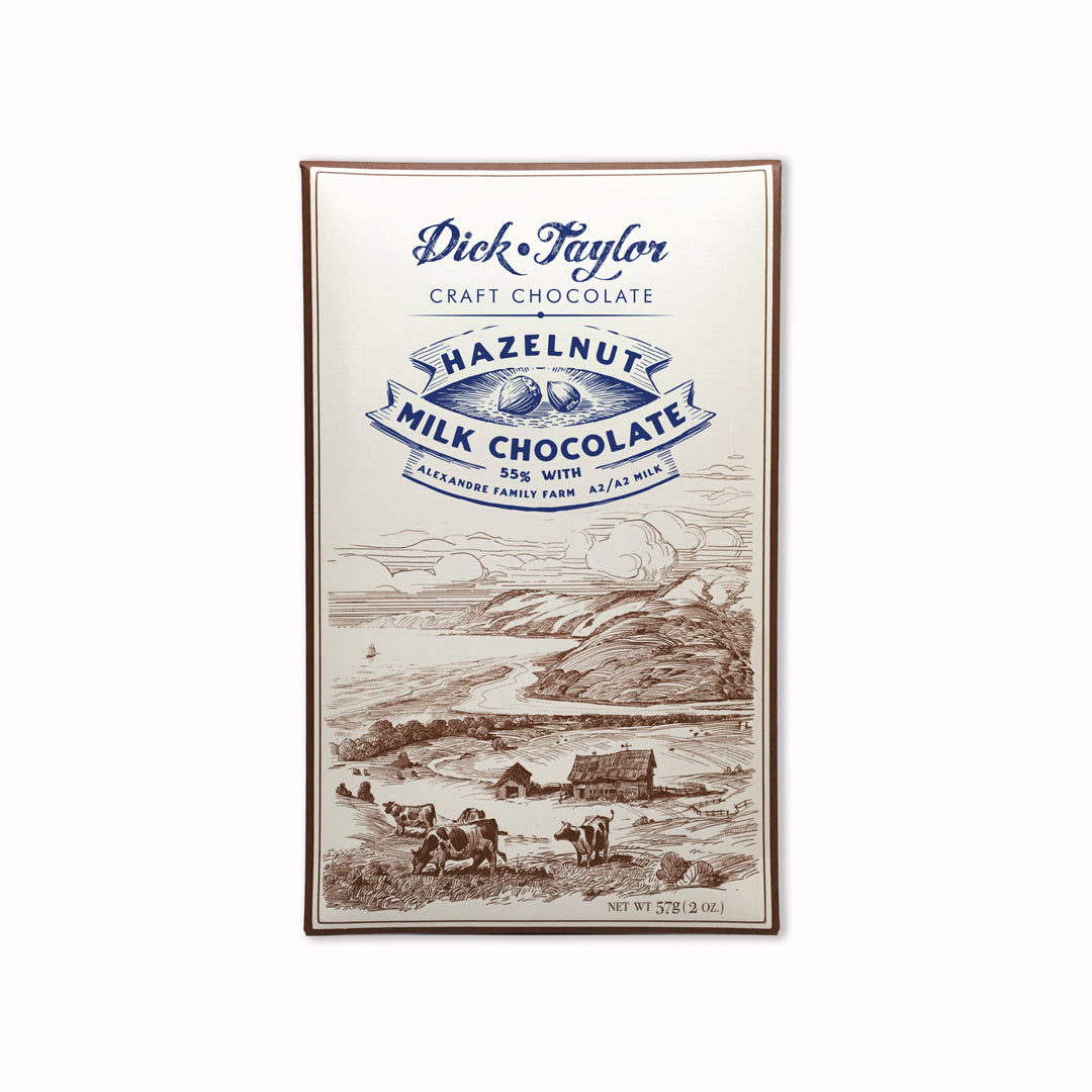 Bean-to-bar milk chocolate with roasted hazelnuts, blending creamy cocoa with nutty crunch in a small-batch craft chocolate bar.