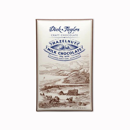 Bean-to-bar milk chocolate with roasted hazelnuts, blending creamy cocoa with nutty crunch in a small-batch craft chocolate bar.