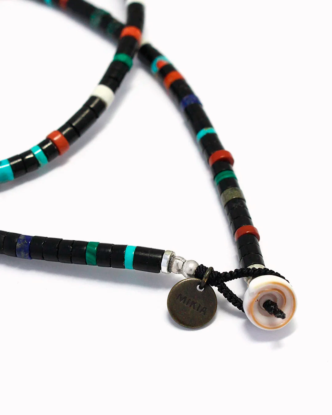 Mikia's handmade Jet Multi Heishi Bead necklace combines black jet with an irregular mix of colour natural stones and shell to create a distinctive beaded necklace with rich variations in colour and texture.&nbsp;