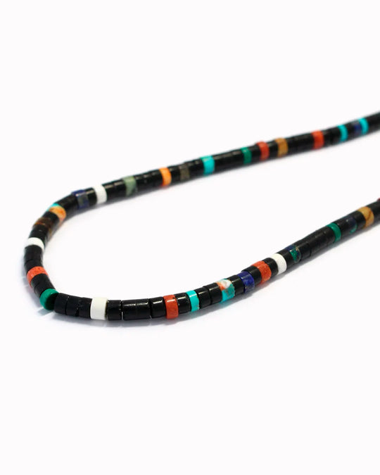 Mikia's handmade Jet Multi Heishi Bead necklace combines black jet with an irregular mix of colour natural stones and shell to create a distinctive beaded necklace with rich variations in colour and texture.&nbsp;