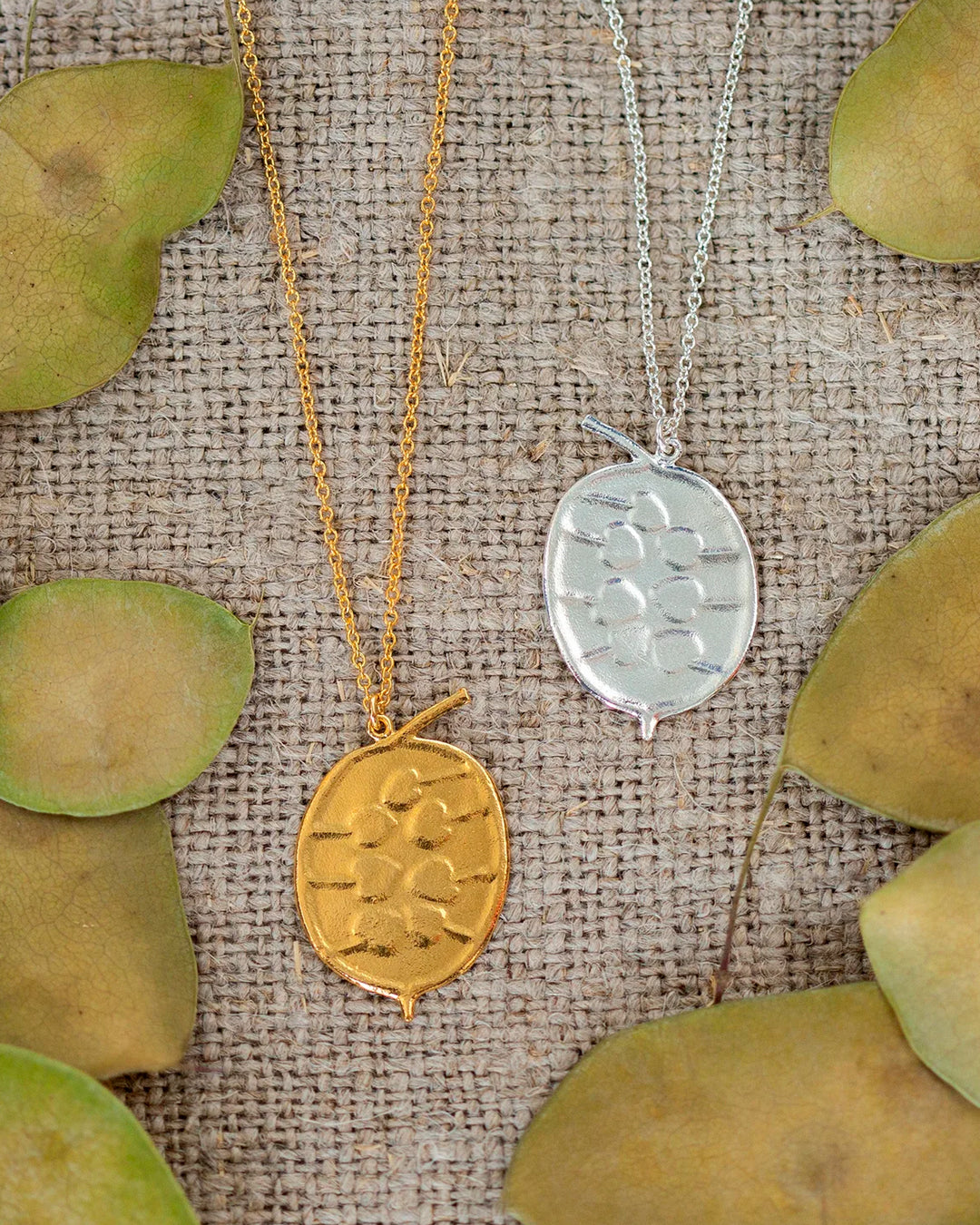 The Honesty Pod necklace is a botanical pendant necklace with charming heart shaped seed detail.