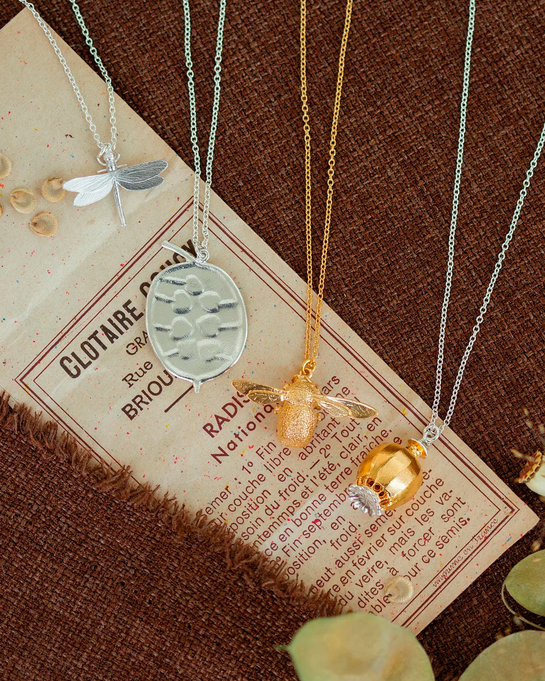 The Honesty Pod necklace is a botanical pendant necklace with charming heart shaped seed detail.