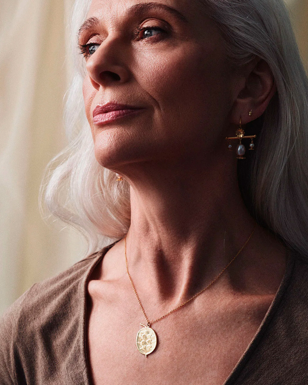 The Honesty Pod necklace is a botanical pendant necklace with charming heart shaped seed detail.