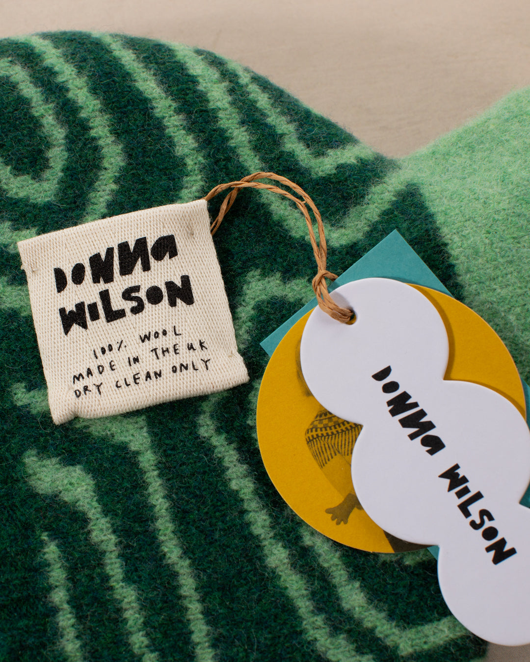 Made in Scotland from 100% lambswool, the Tortoise Hot Water Bottle is a soft and cuddly companion by Donna Wilson. 