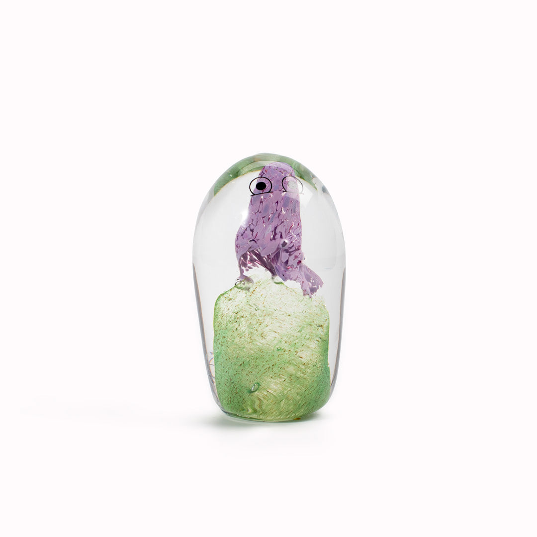 Totem Crystal Blob is formed by dipping and/or rolling molten (hot!) clear glass into smaller chunks of brightly coloured glass droplets,