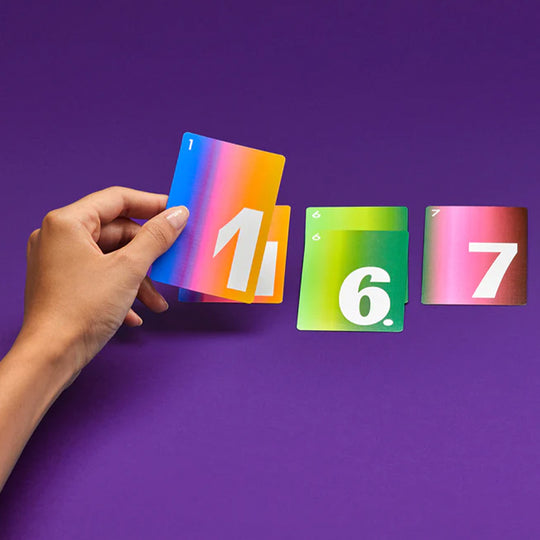 I’m Out is a clever, push-your-luck card game where reading the moment is everything. Stay in to collect more points; or get out before the round collapses. Card Play