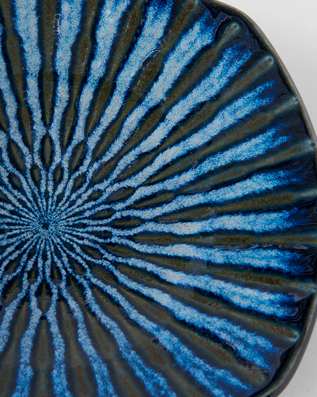18cm square plate with a pretty indigo blue 'drip' effect glaze to mix and match in with your tableware collection.