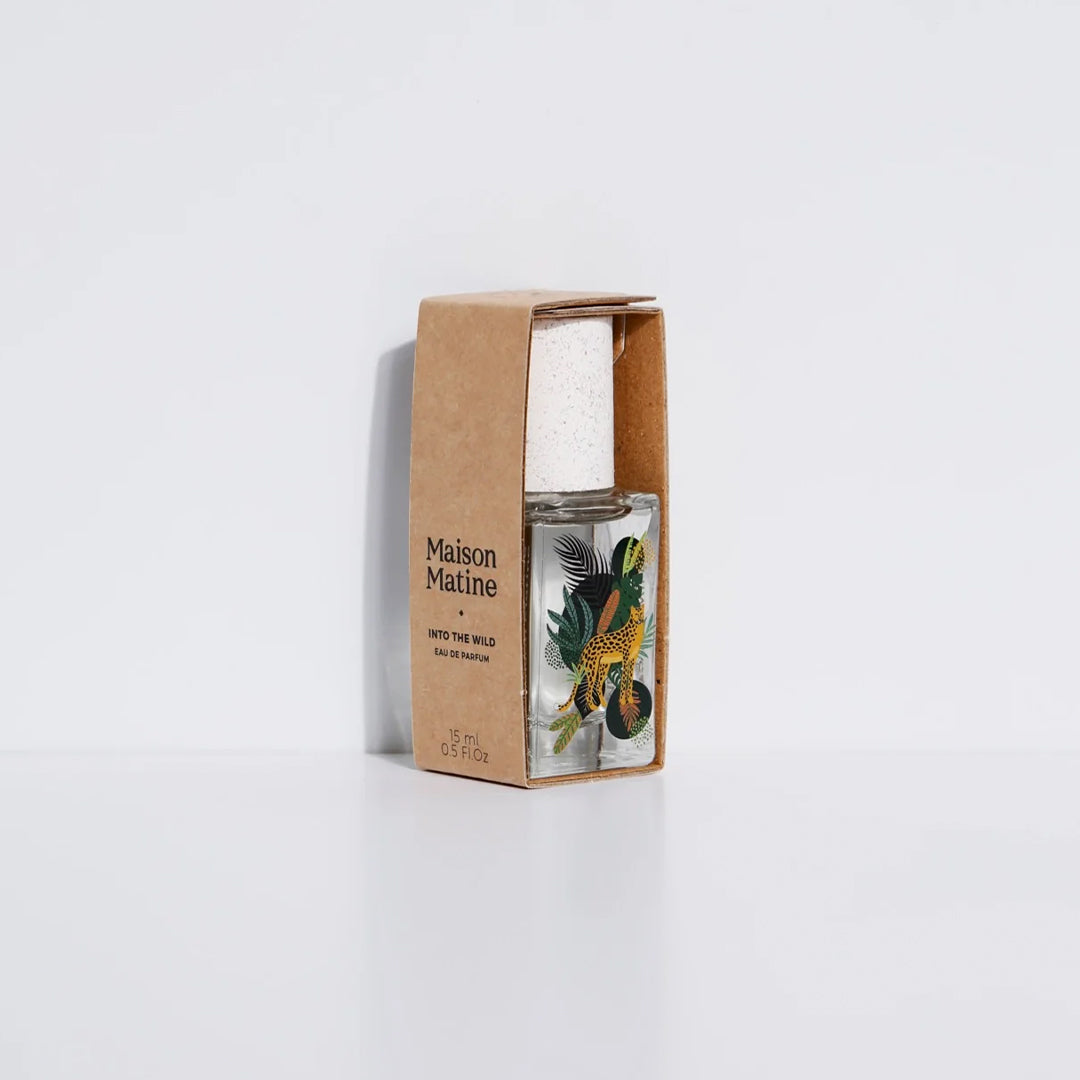 Maison Matine's 'Into the Wild' is a scent inspired by nature, travel and life's adventures, all housed in an illustrative glass bottle. 15ml bottle shown, with leopard and jungle leaves. In cardboard sleeve.