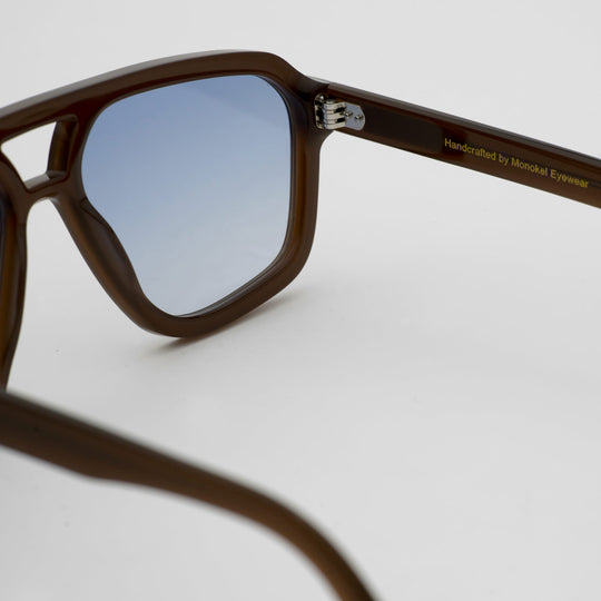 Retro, vintage 1970's style large aviator style black framed sunglasses with a blue gradient lens colour