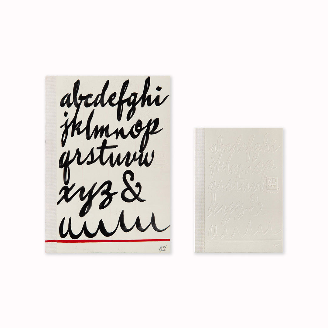 Original Artwork with the A6 plain paper notebook has an off white cover embossed with some ace artwork by Kenji Nakayama featuring a calligraphic alphabet. The MD paper logo is also embossed.  