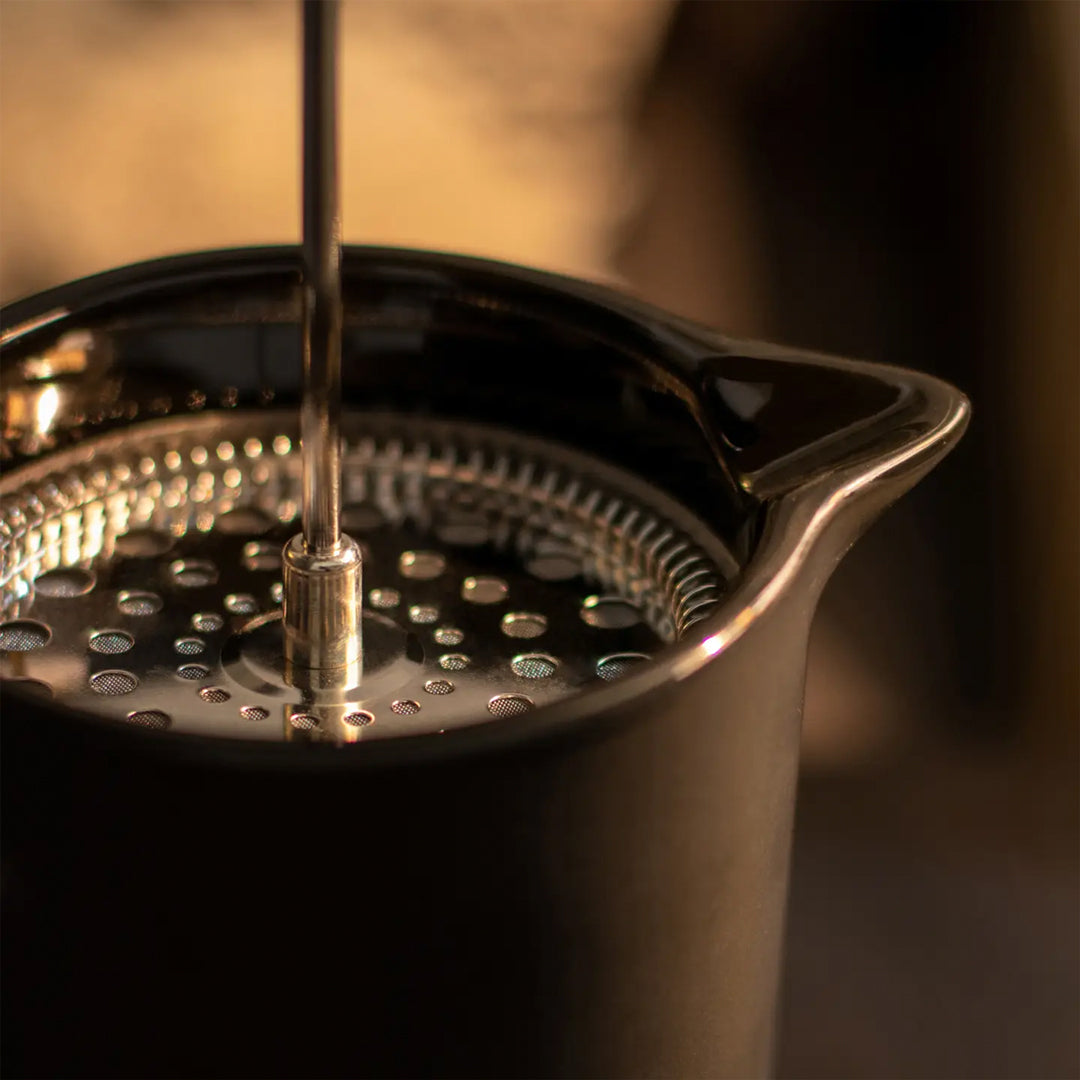 Matt Black porcelain French Press with stainless steel plunger. Contemporary styling and matt black porcelain make this French Press an easy 'go to' essential for your morning coffee Lifestyle image