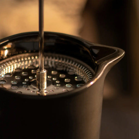 Matt Black porcelain French Press with stainless steel plunger. Contemporary styling and matt black porcelain make this French Press an easy 'go to' essential for your morning coffee Lifestyle image