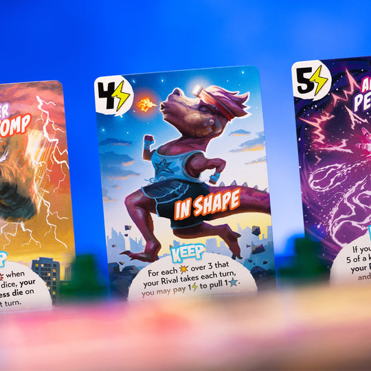 The original King of Tokyo game is something of a classic. Kind of an attack based Yahtzee where players get to play a giant monster that attacks both the city and each other with dice and power cards determining the outcome.