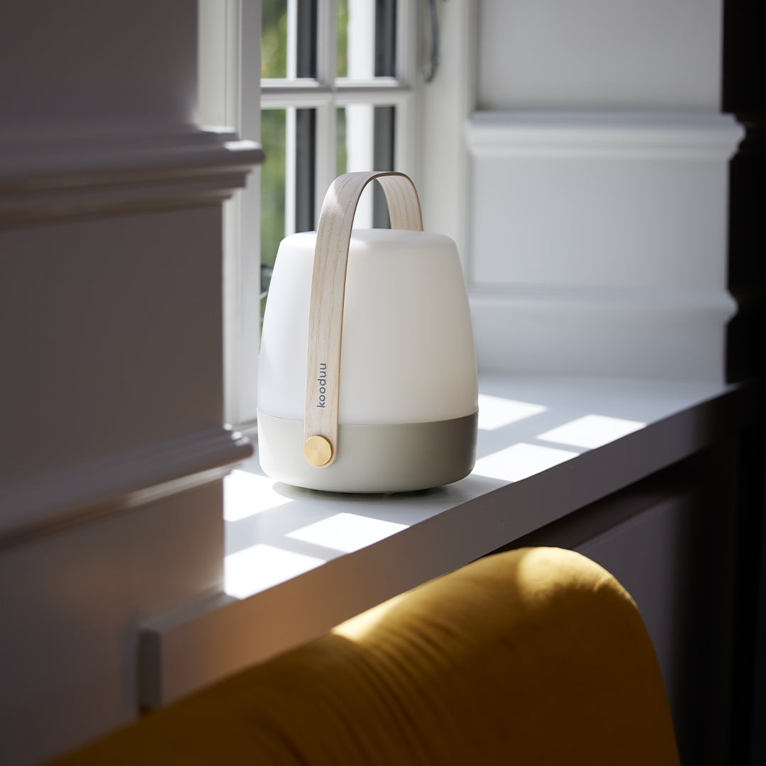 On windowledge, The Lite-Up in Earth from Kooduu is a battery operated portable light with a pleasing wooden carry handle and Scandinavian interior feel.