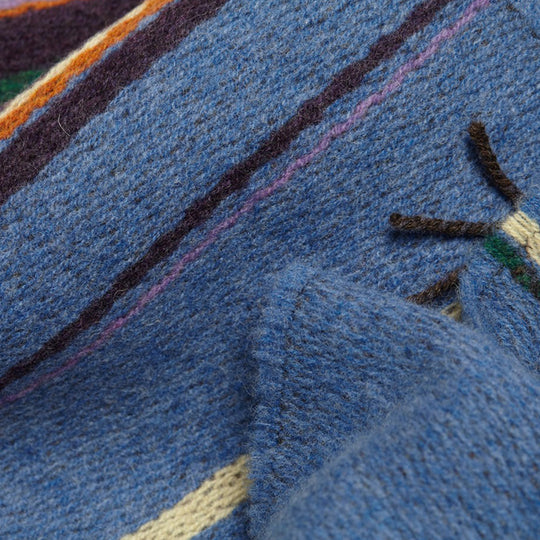 The Lavanda lambswool Scarf by Wallace and Sewell showcases the intricate craft of textile design, blending traditional techniques with modern aesthetics. 