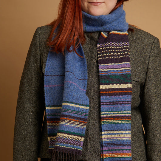The Lavanda lambswool Scarf by Wallace and Sewell showcases the intricate craft of textile design, blending traditional techniques with modern aesthetics. 