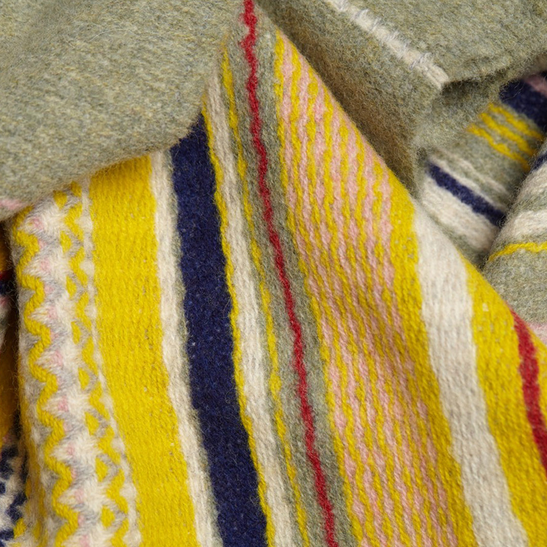 The Lavanda lambswool Scarf by Wallace and Sewell showcases the intricate craft of textile design, blending traditional techniques with modern aesthetics
