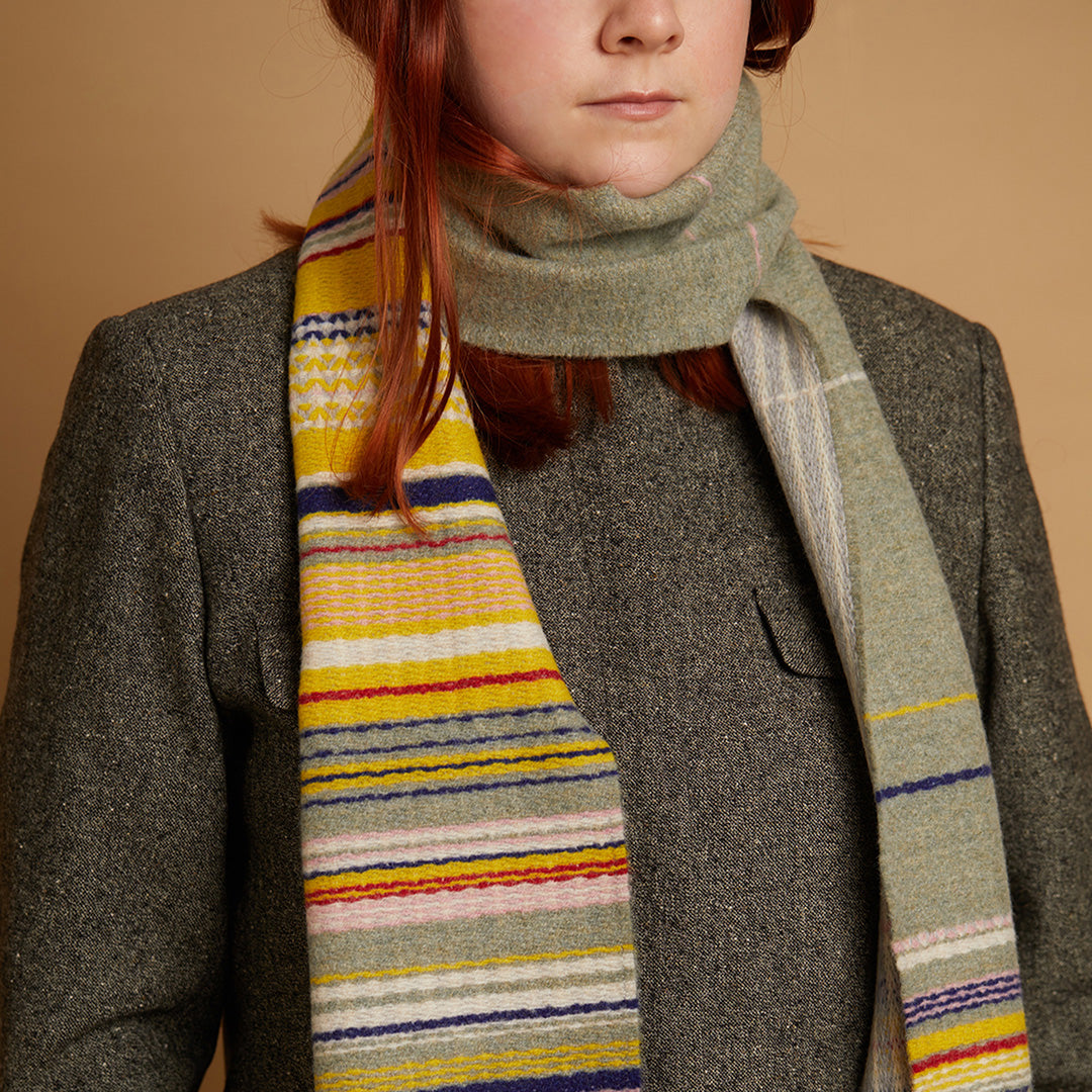 The Lavanda lambswool Scarf by Wallace and Sewell showcases the intricate craft of textile design, blending traditional techniques with modern aesthetics