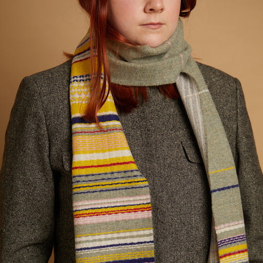The Lavanda lambswool Scarf by Wallace and Sewell showcases the intricate craft of textile design, blending traditional techniques with modern aesthetics