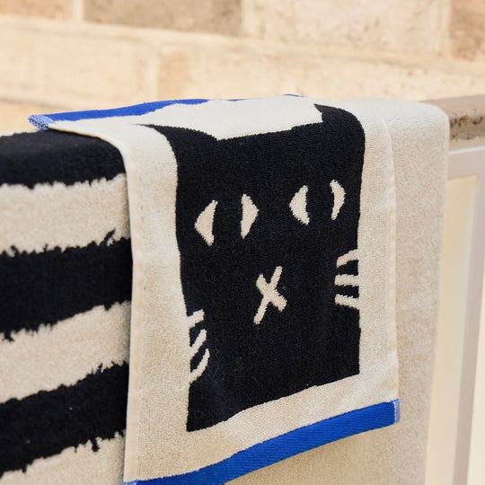 The Donna Wilson Lazy Cat Face Cloth brings a playful, design-led twist to everyday linen.