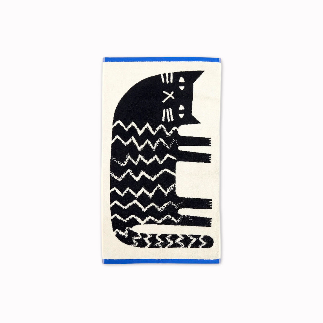 The Donna Wilson Lazy Cat Hand Towel brings a playful, design-led twist to everyday linen