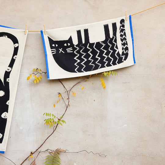 The Donna Wilson Lazy Cat Hand Towel brings a playful, design-led twist to everyday linen