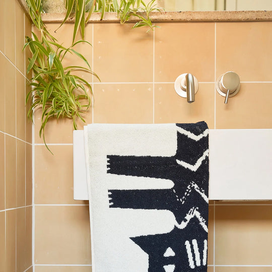 The Donna Wilson Lazy Cat Hand Towel brings a playful, design-led twist to everyday linen