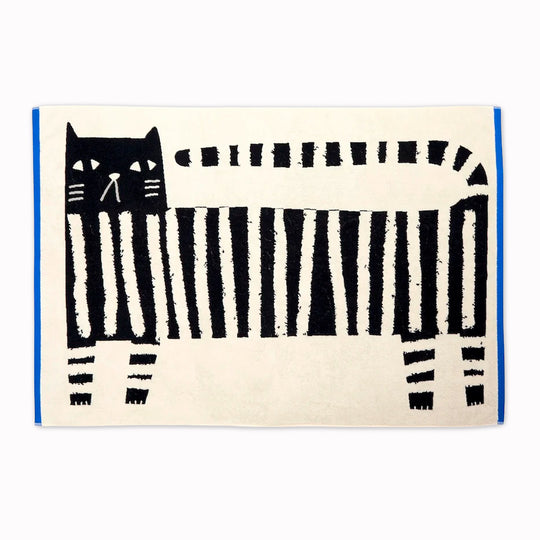 The Donna Wilson Lazy Cat Textile collection brings a playful, design-led twist to everyday bathroom linens. Simple graphic striped cat illustration with a bold blue edge binding.