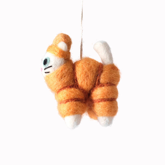 Lee, Cat in an orange puffa jacket. A playful felted Christmas tree decoration designed by Elliot Kruszynski.