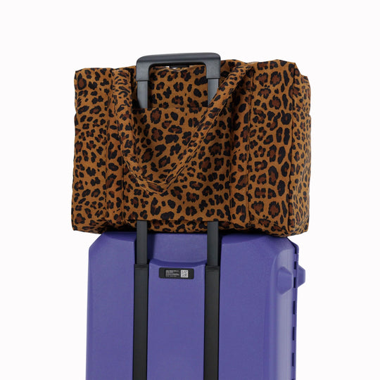 Large Cloud Carry-On in Leopard from Baggu, an impeccably crafted travel essential designed for discerning travelers.