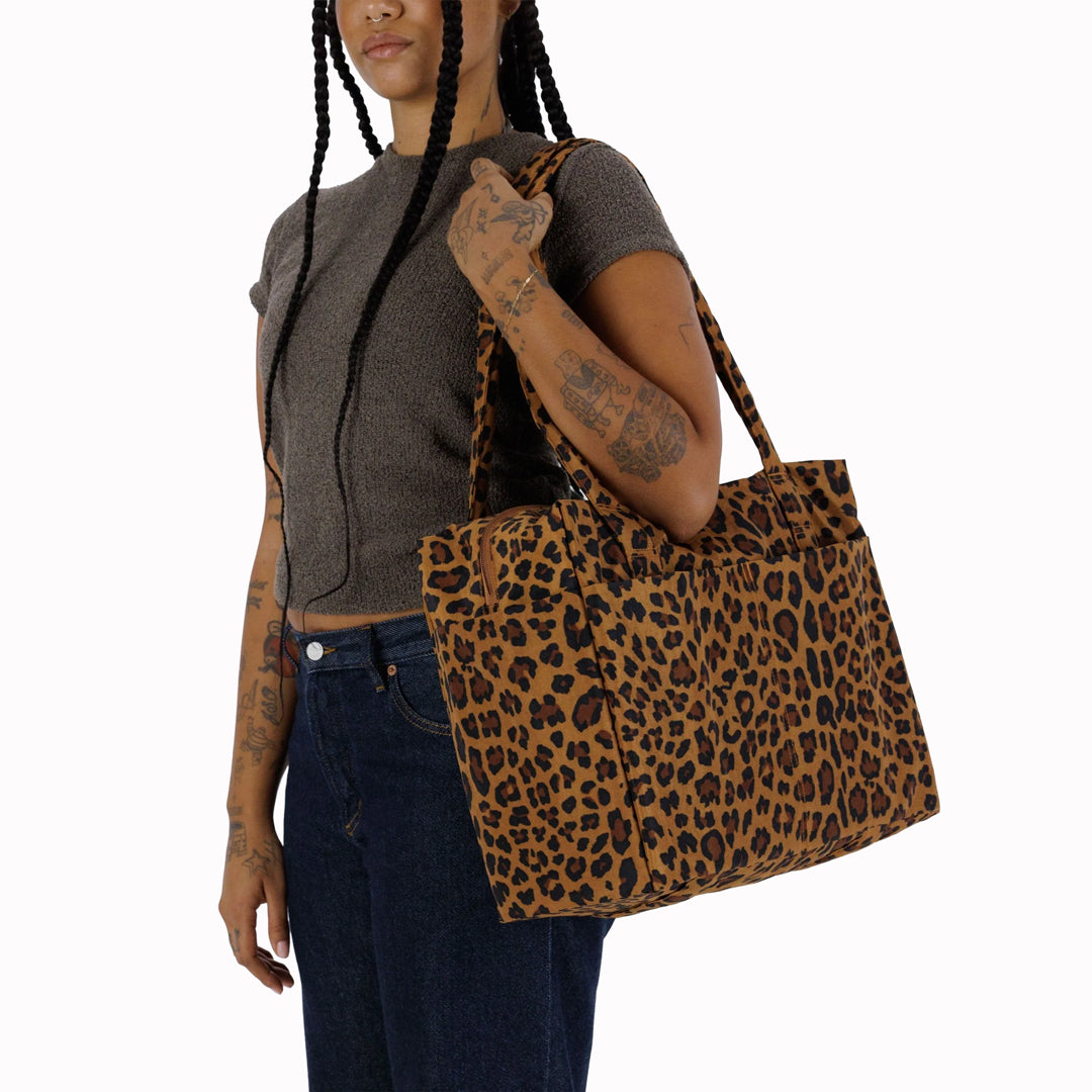 Small Cloud Carry-On in Wisteria from Baggu, an impeccably crafted travel essential designed for discerning travelers.