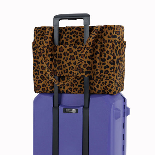 Small Cloud Carry-On in Wisteria from Baggu, an impeccably crafted travel essential designed for discerning travelers.