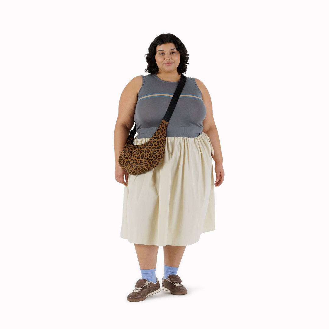 The Medium Crescent Bag in Leopard print from Baggu is a stylish and versatile accessory that can complement any outfit.