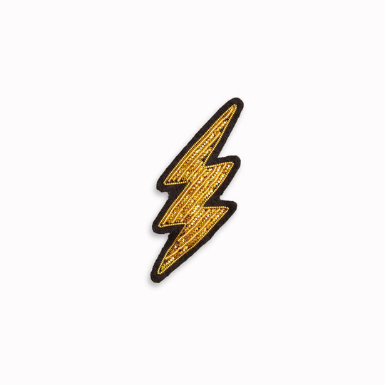 Make a statement with this beautiful gold lightning bolt hand embroidered decorative lapel pin by Paris based Macon et Lesquoy