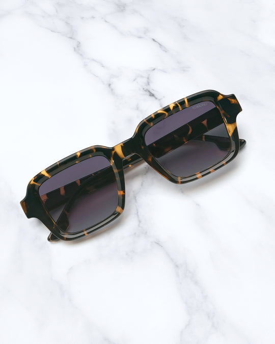 The Lionel takes a broader square frame and pares it back with clean acetate construction and restrained detailing.
