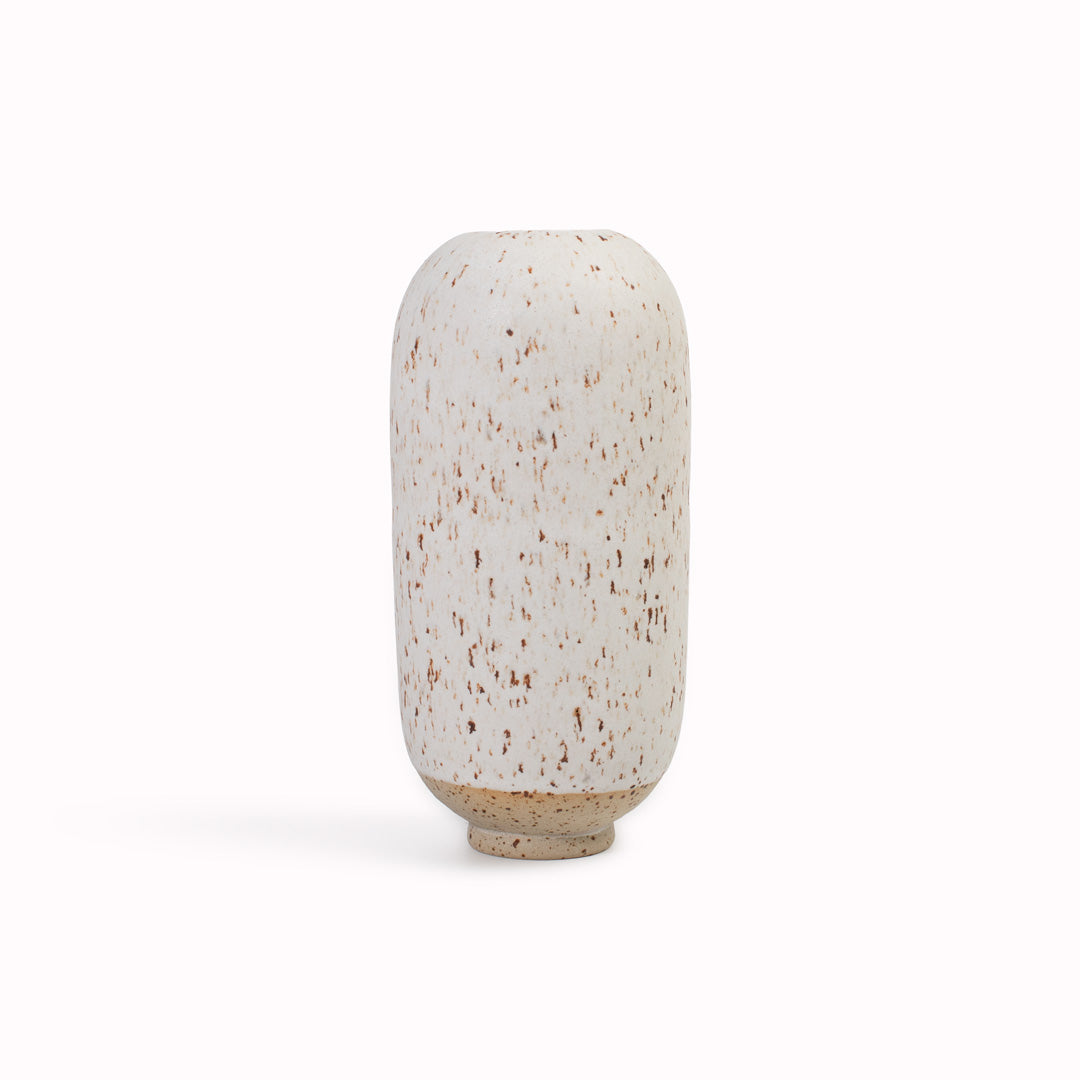 The speckled white, Llama Fur&nbsp;design is hand-thrown in watertight stoneware. Due to the rounded taper at the top of the vase