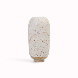 The speckled white, Llama Fur&nbsp;design is hand-thrown in watertight stoneware. Due to the rounded taper at the top of the vase