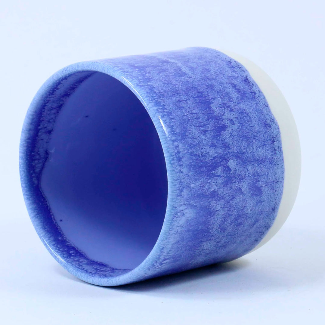 The Quench Cup, introduced in March 2019, is part of the Tokyo tableware series. The porcelain cup fits perfectly in your hand, allowing you to snack or drink away while watching television.