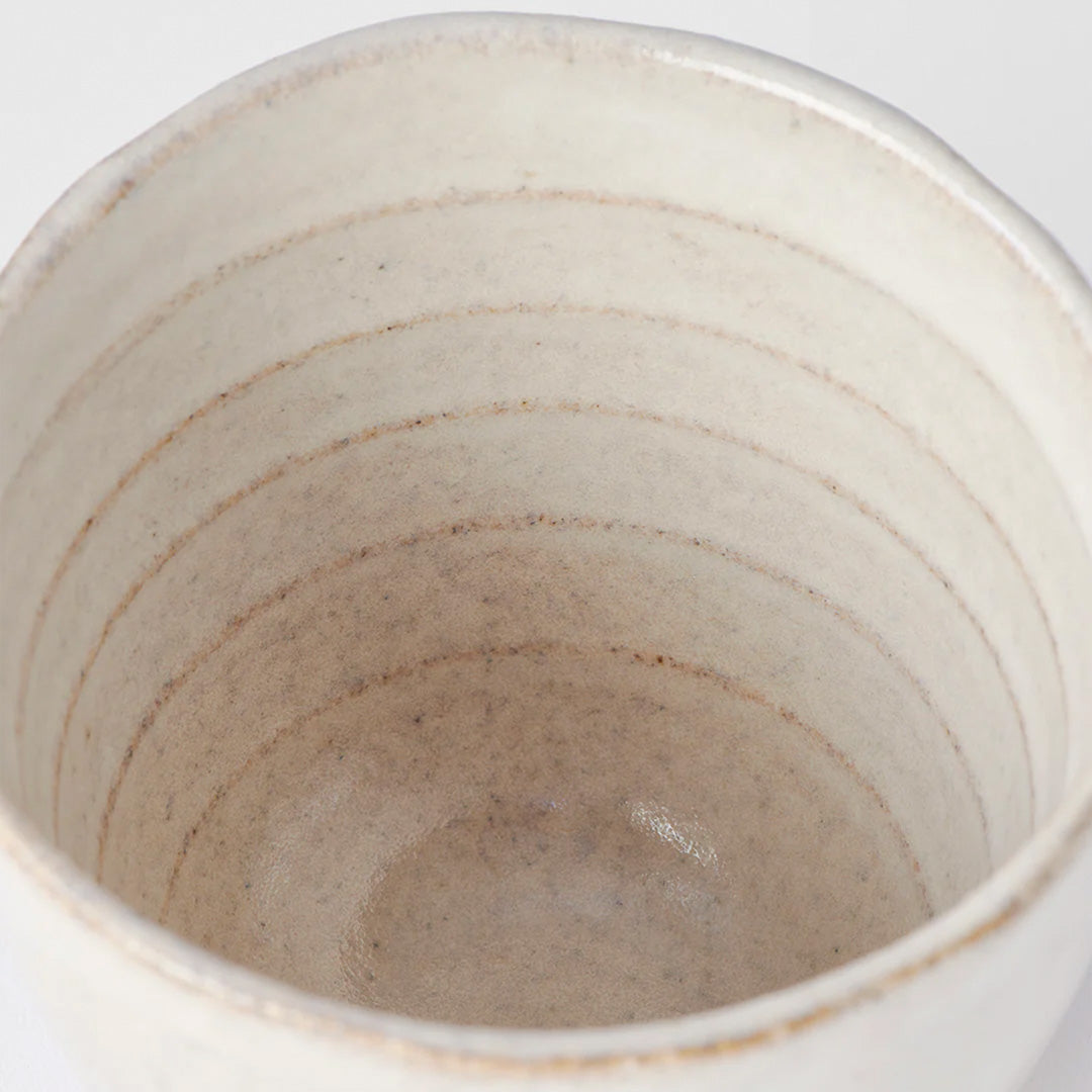 The Fawn Glazed Lopsided Cup on a bisque ceramic base is Made in Japan and holds approx 200ml. 