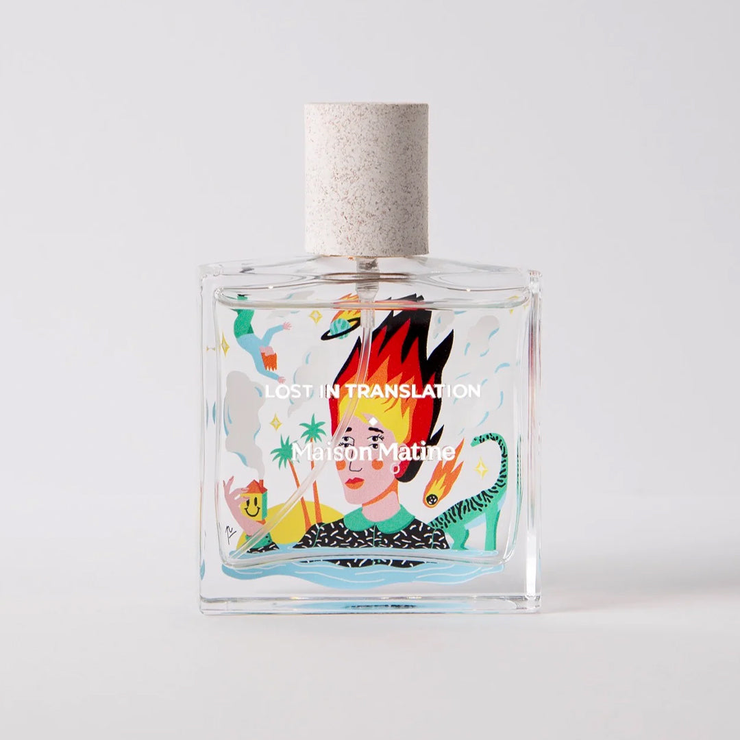Maison Matine's 'Lost in Translation' is a scent inspired by the idea of living life to the full, this being the first day of the rest of your life, all housed in an illustrative glass bottle. 50ml glass bottle with flaming haired head shown.