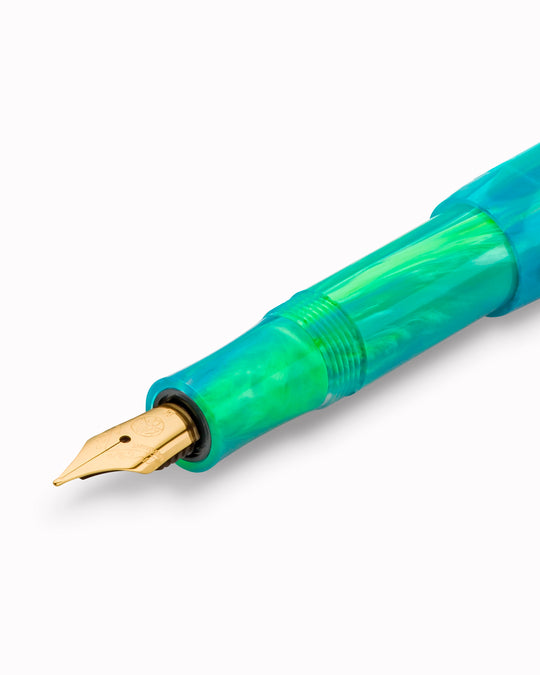 The Kaweco COLLECTION Fountain Pen in Marble Ocean combines deep blue and green tones in a marbled finish, with each pen carrying a slightly different pattern. 