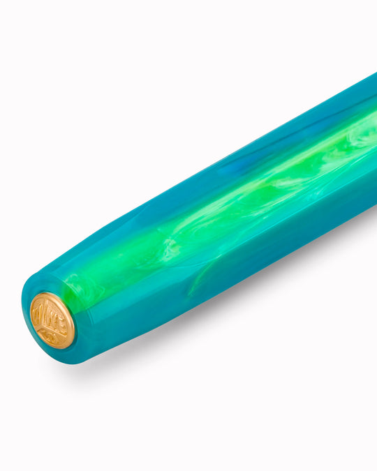 The Kaweco COLLECTION Fountain Pen in Marble Ocean combines deep blue and green tones in a marbled finish, with each pen carrying a slightly different pattern. 