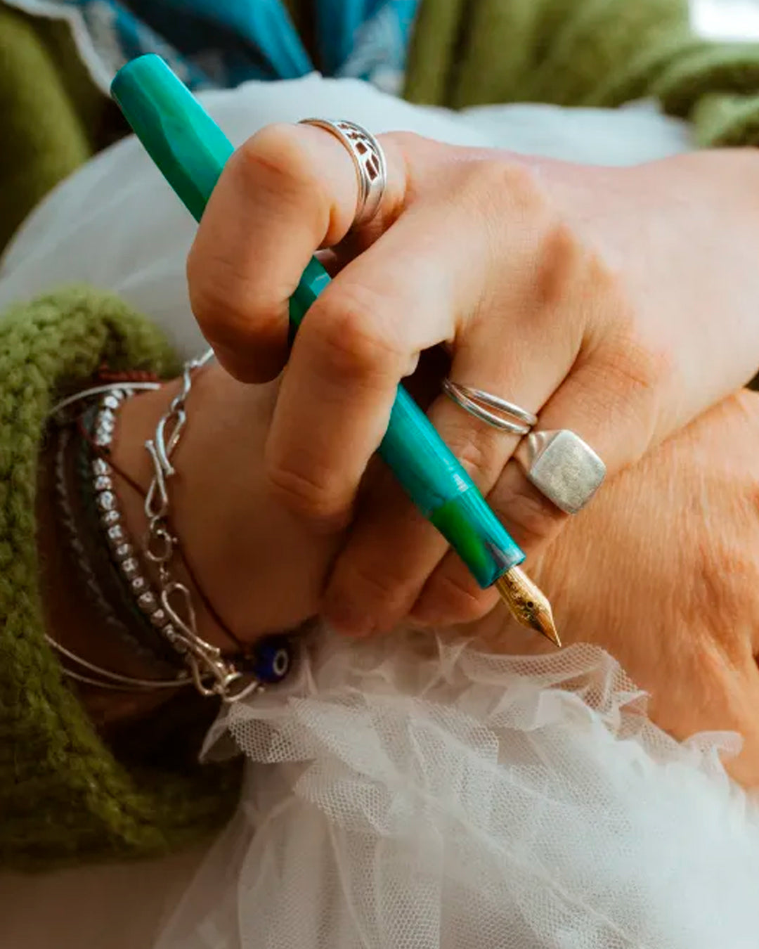 The Kaweco COLLECTION Fountain Pen in Marble Ocean combines deep blue and green tones in a marbled finish, with each pen carrying a slightly different pattern. 